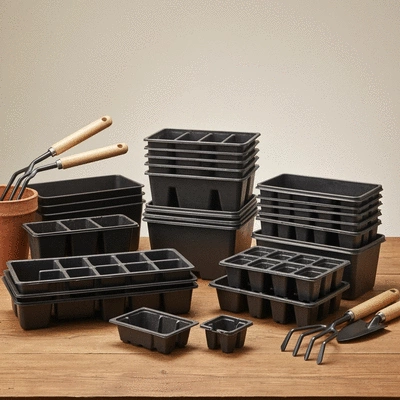 An array of various plastic seedling trays in different sizes and configurations, neatly organized